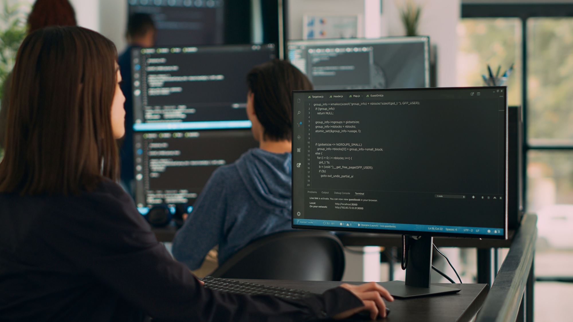 Database programer writing source code on terminal window with html script